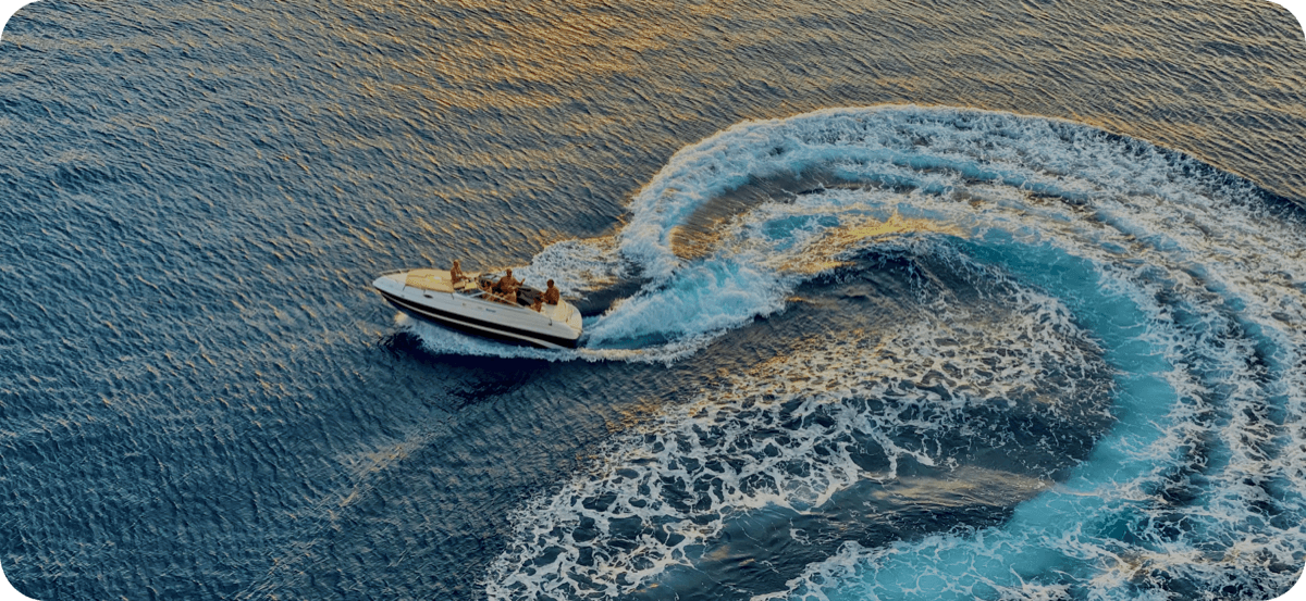 Fast boat crossing turquoise ocean water